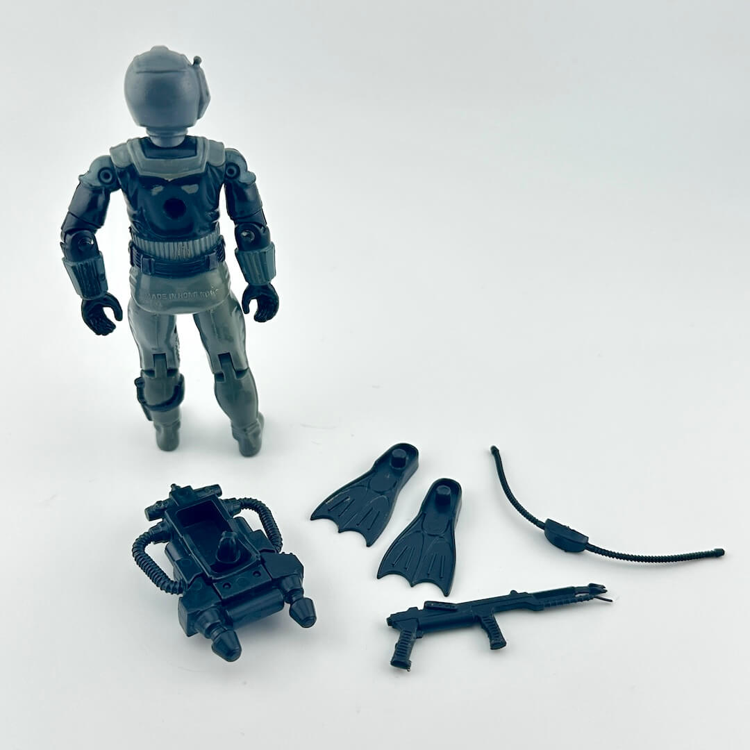 G.I. Joe action figure with accessories against white background.