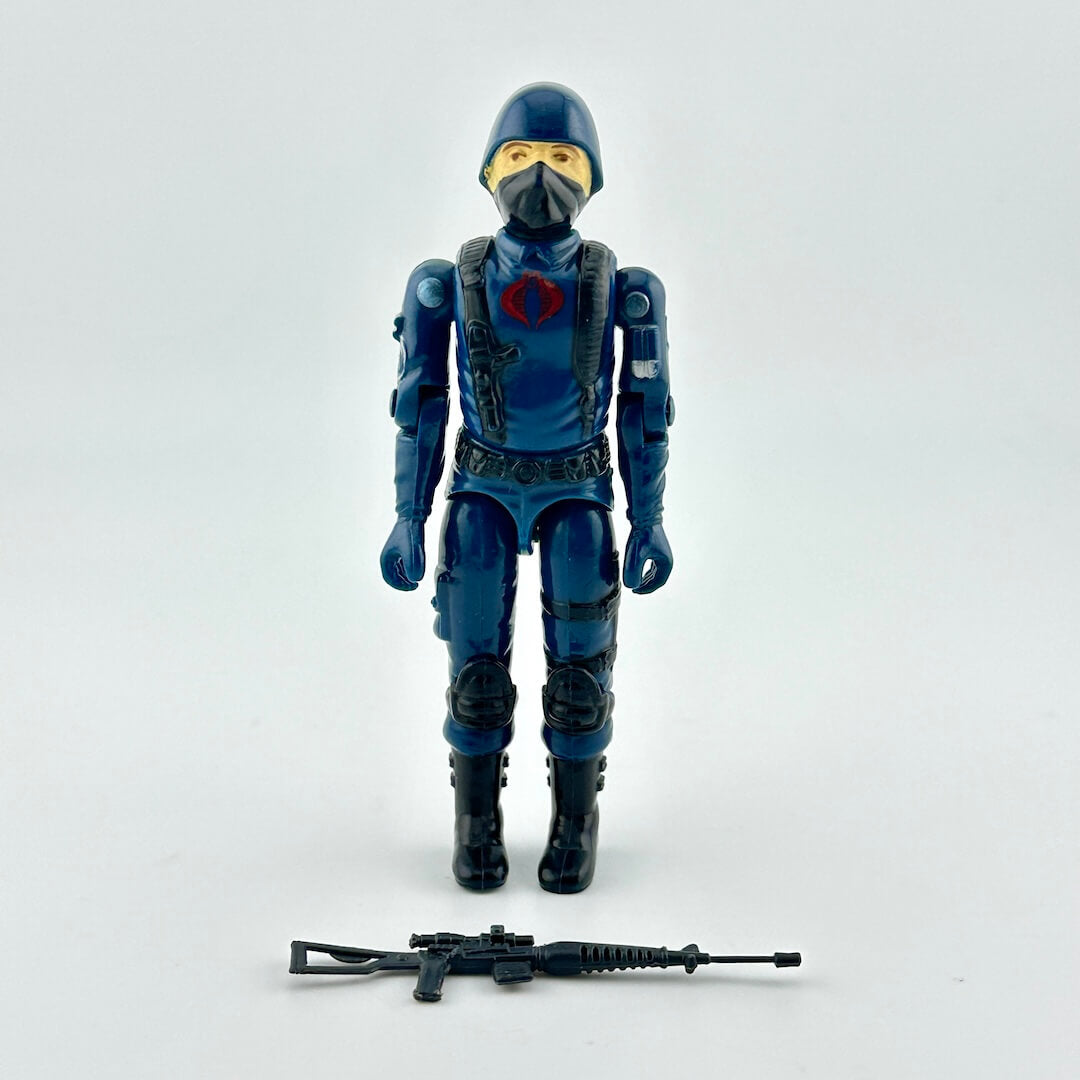 Action figure in blue and black costume with helmet and mask on a white background