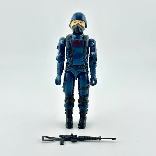 Action figure in blue and black costume with helmet and mask on a white background