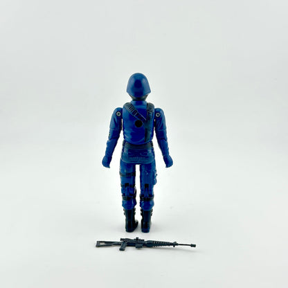 Back of GI Joe Cobra action figure with weapon against white background.