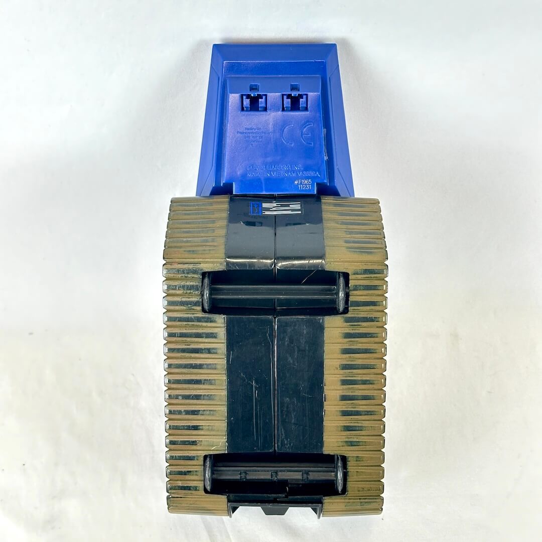 Underside view of toy tank to show minimal wear to bottom wheels. 