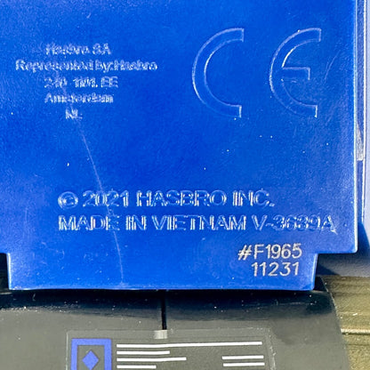 Close-up of embossed copyright and manufacturer information on underside of toy. 