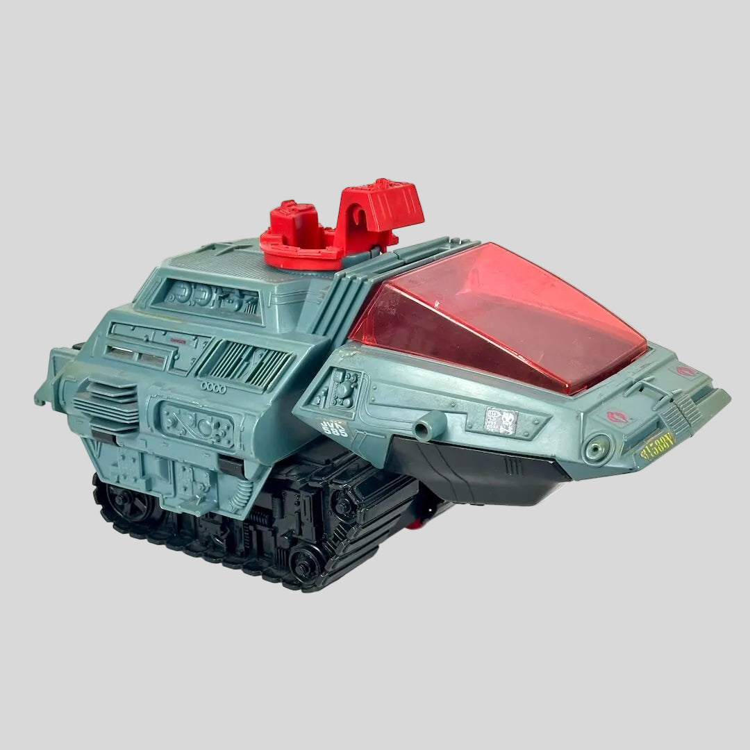 Vintage toy tank with red accents and green-gray body. 