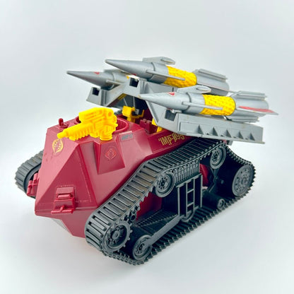 Toy tank with missiles on a white background