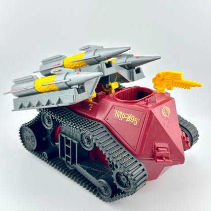 Toy tank model with missiles and a gun on a white background