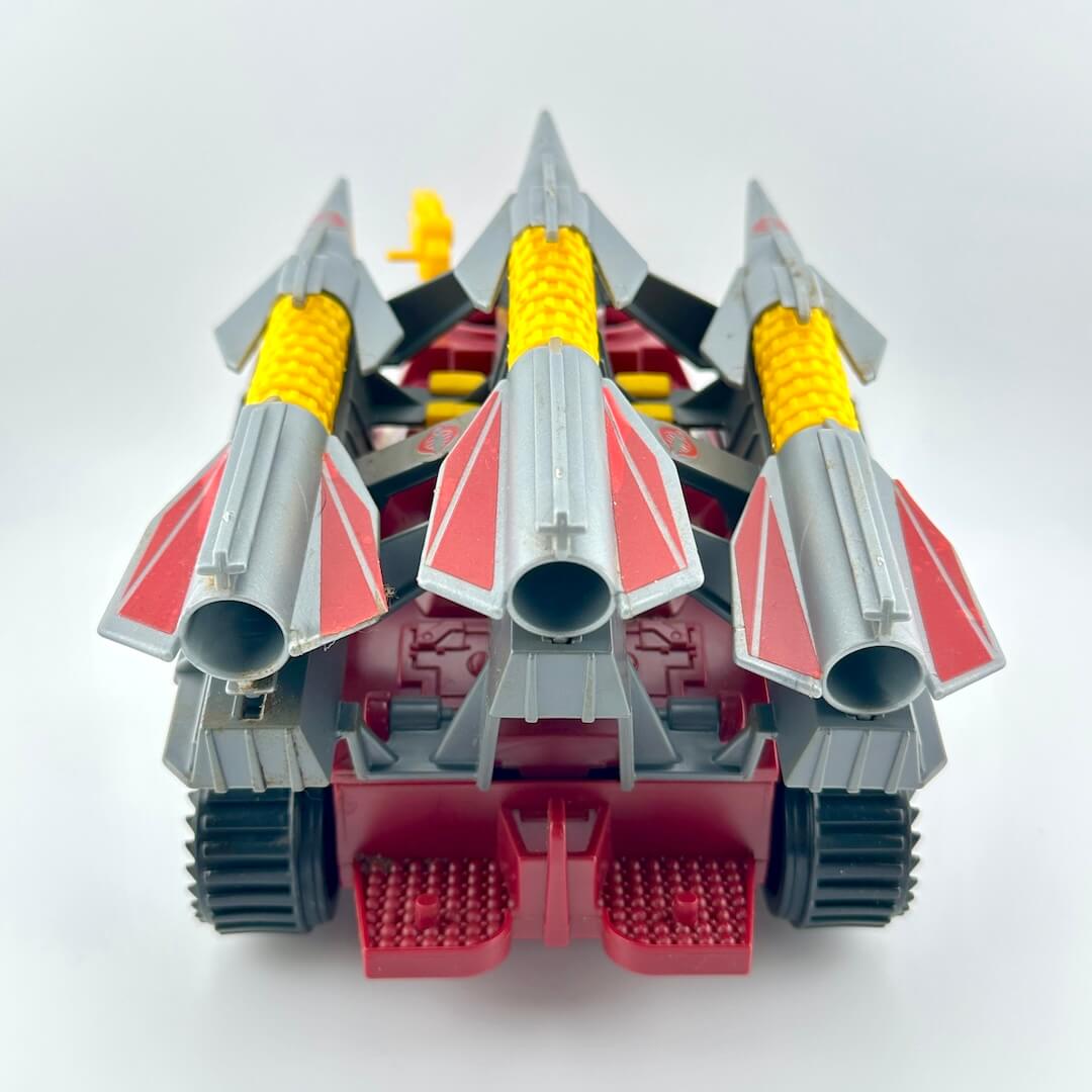 Toy vehicle with multiple rocket nozzles on a white background