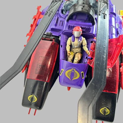 Front view of purple & red toy helicopter to see pilot in cockpit and sticker details. 