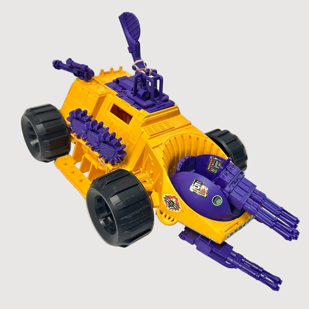 Orange toy vehicle with purple guns and details against white background. 