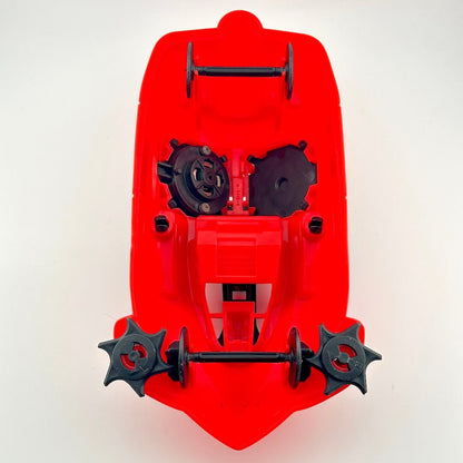 Red and black toy vehicle against white background. 