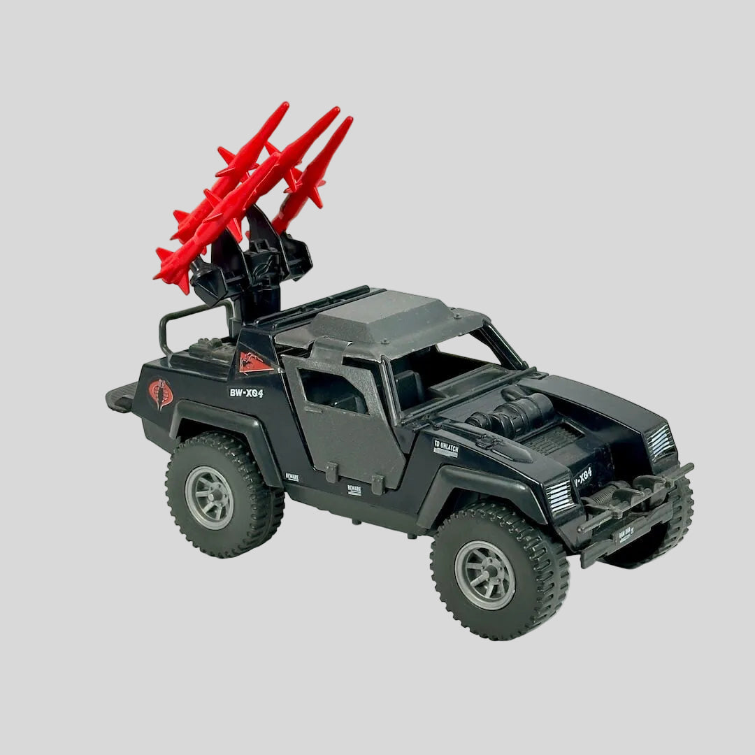 Toy vehicle with red missiles on a white background