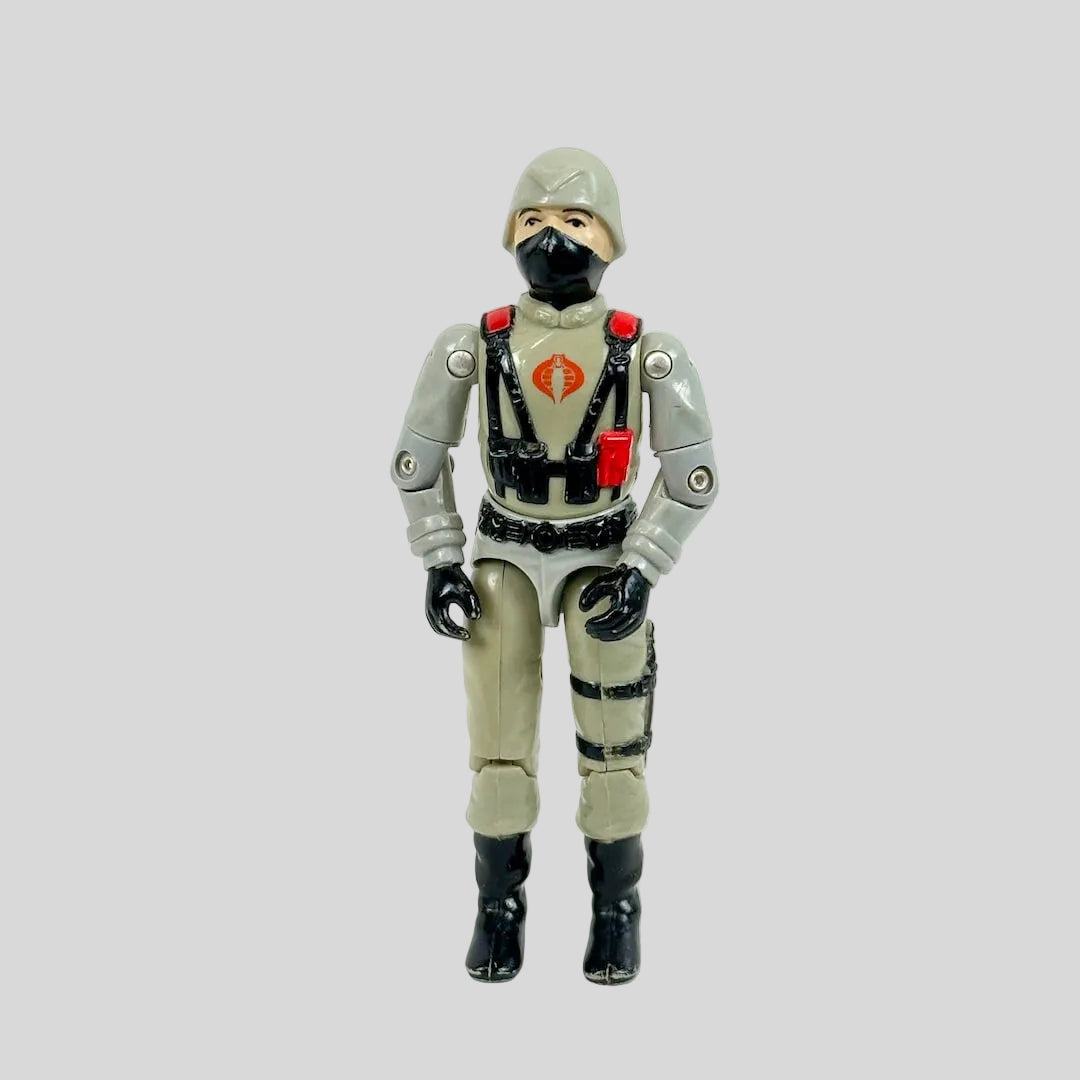 Toy figure in a flight suit with a mask on a white background