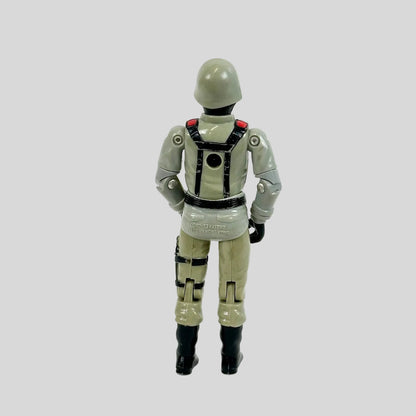 Toy figure of a character in a gray suit with black boots on a white background