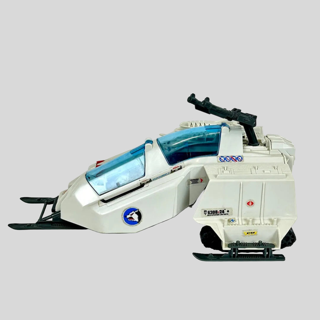 Toy snowmobile with a white base and blue accents on a light gray background