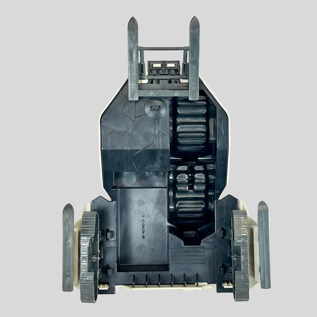 Underside of toy vehicle against light gray background.