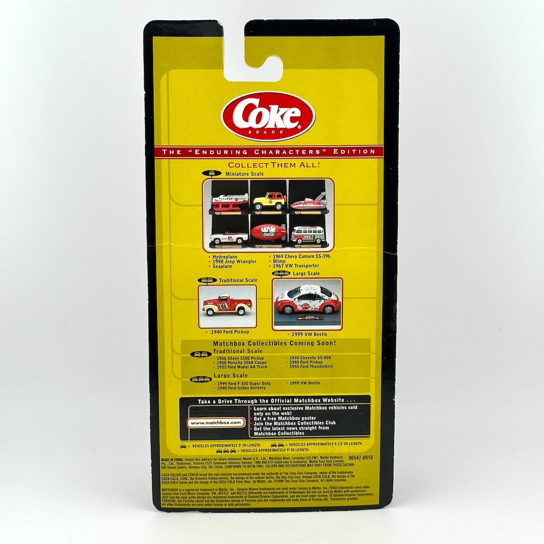 The back of a vintage 1:24 scale model car package featuring Coca-Cola branding and character art.