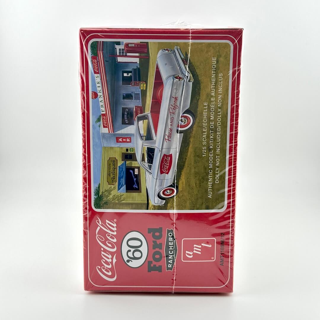 Model car packaging featuring a Coca-Cola and Ford truck design on a white background