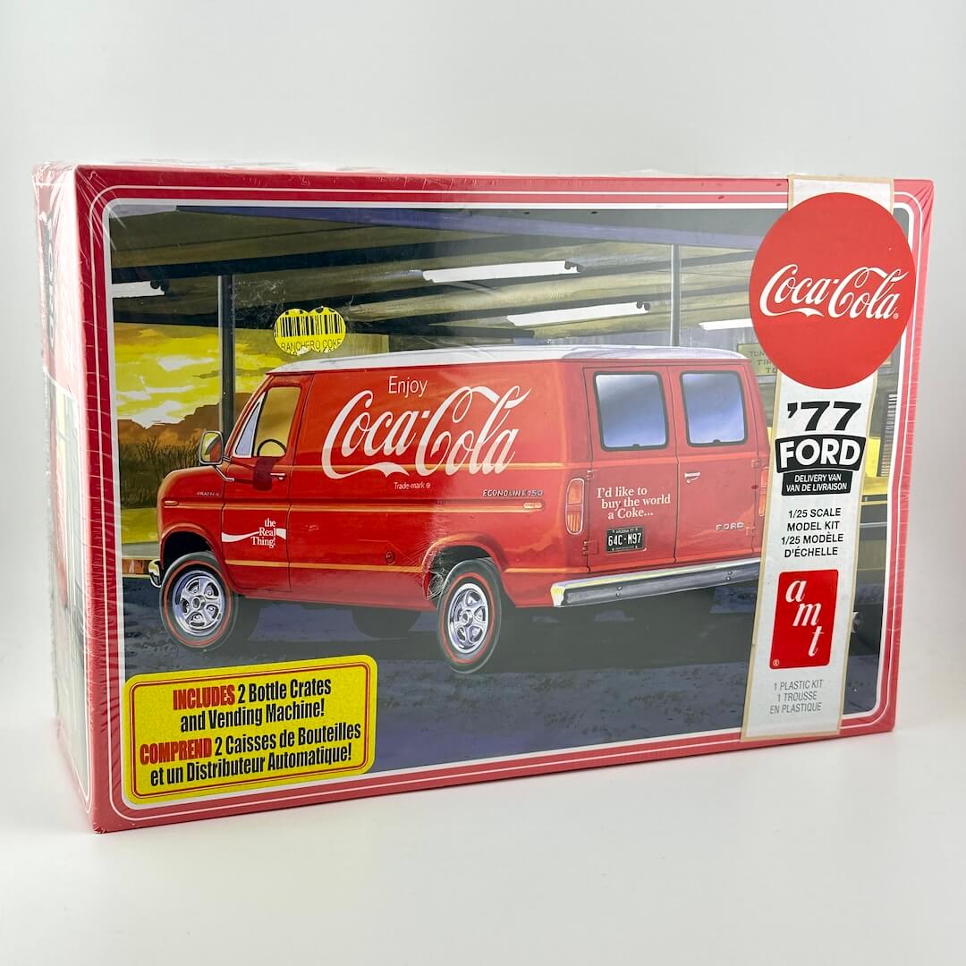 Coca-Cola delivery van model kit on light background. 