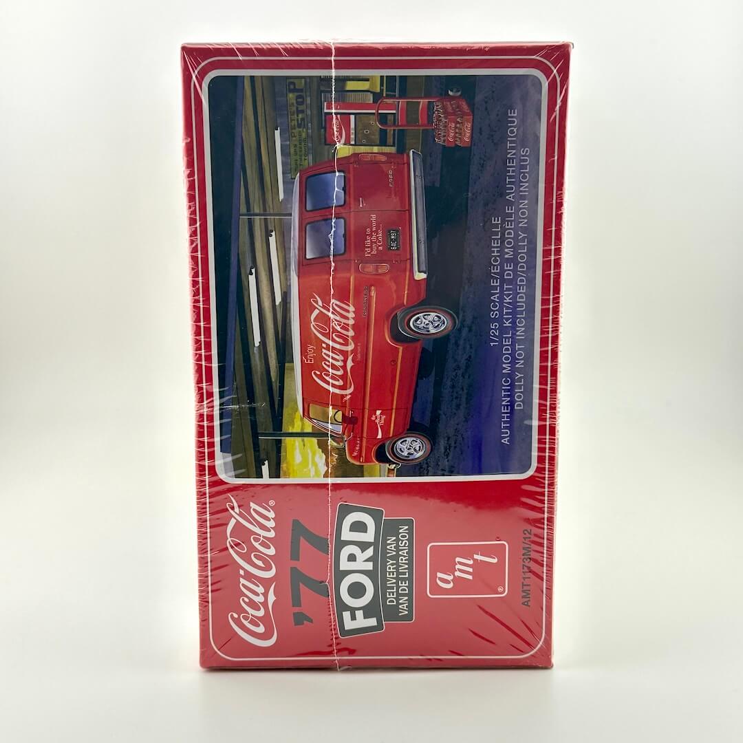 Model car packaging with Coca-Cola and Ford branding on a white background