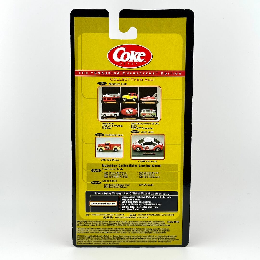 Back of diecast car packaging with Coke logo, product information, and images of other available cars. 
