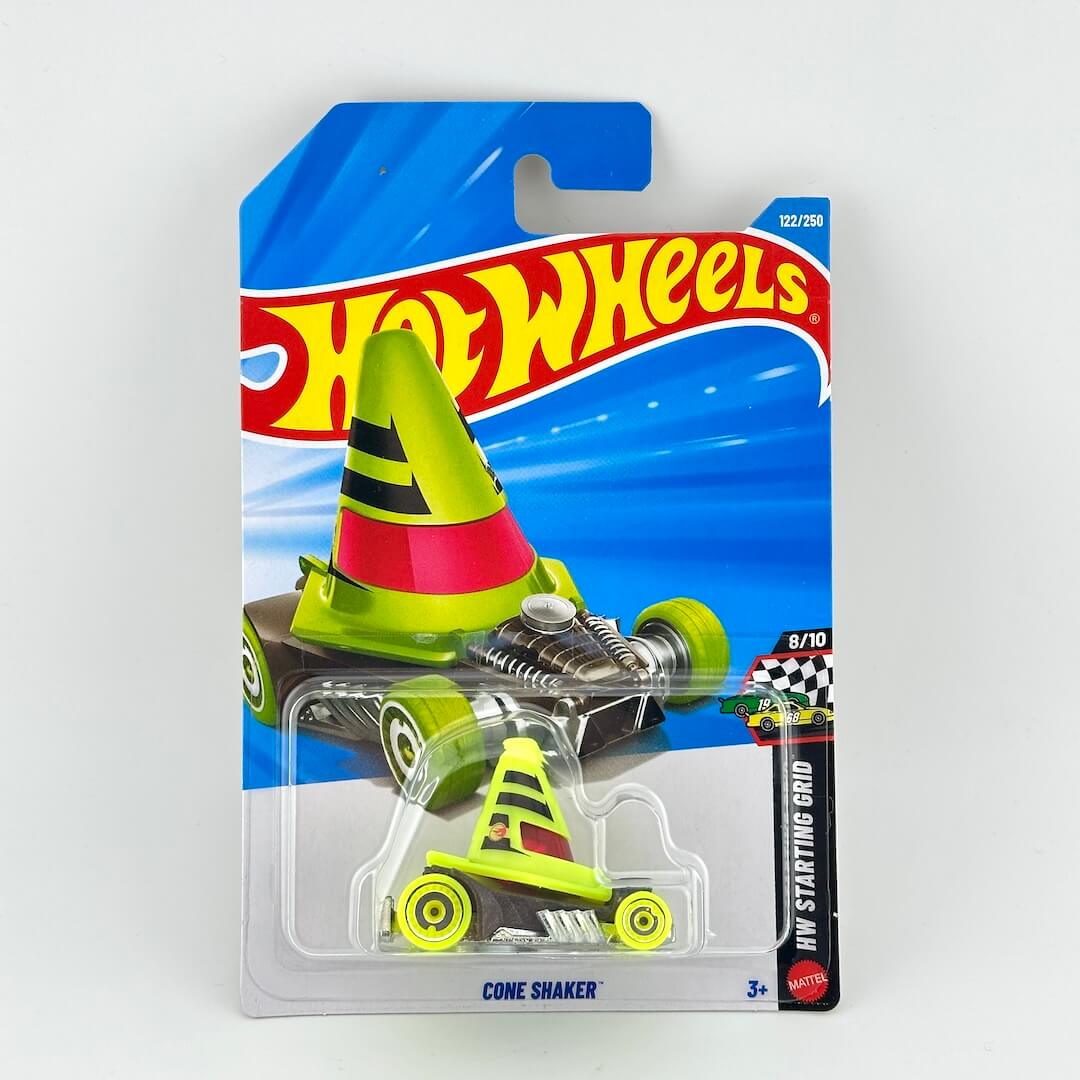 A Hot Wheels toy car in its original blister packaging, featuring a lime green and neon yellow cone-shaped race car .