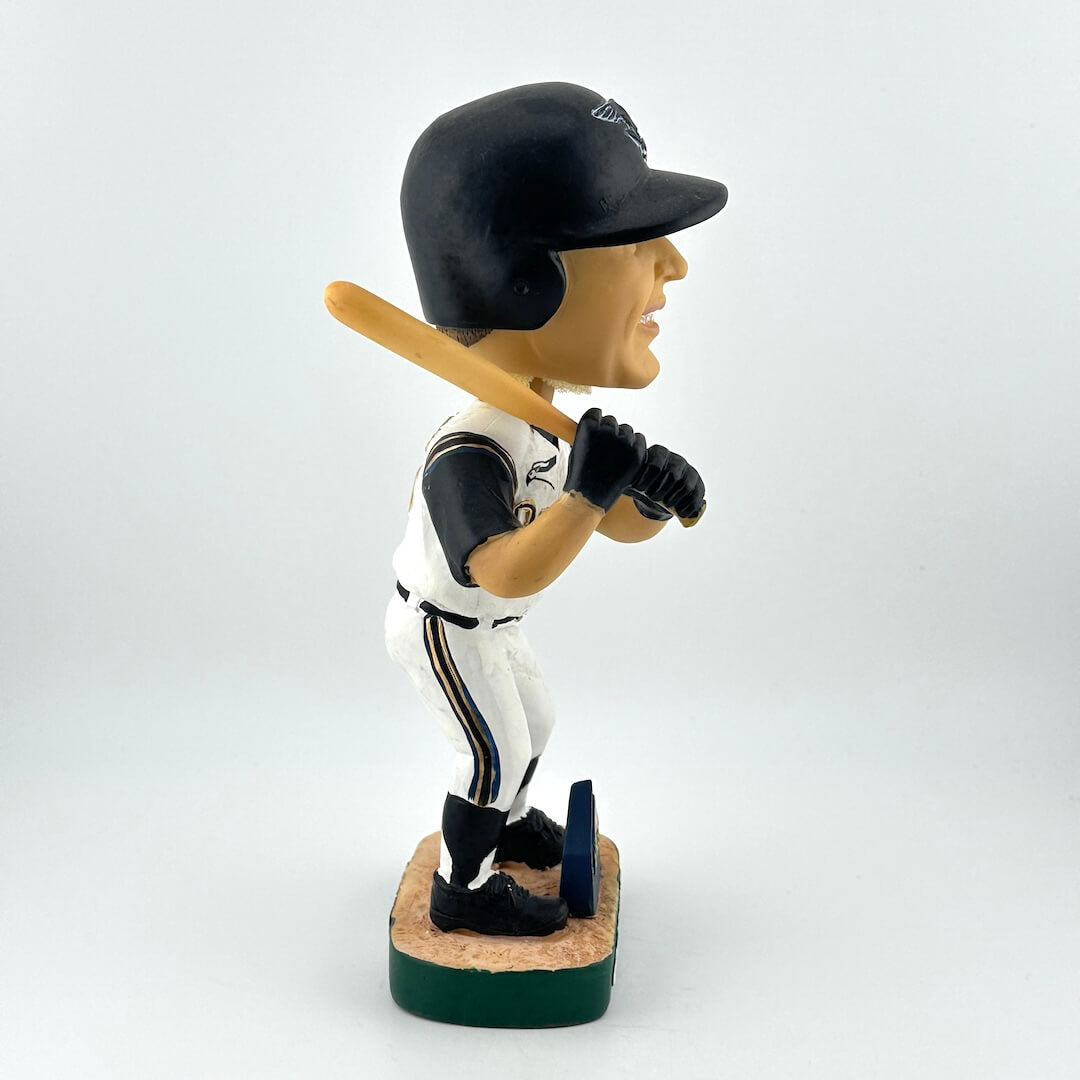 Baseball bobblehead figurine holding a bat on a white background