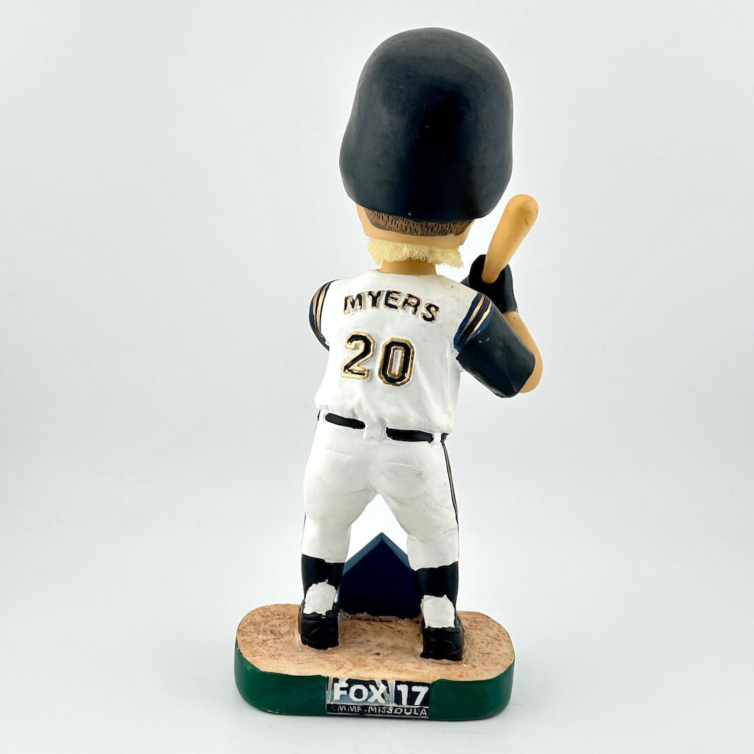 Baseball bobblehead figure with a white uniform and black helmet on a white background