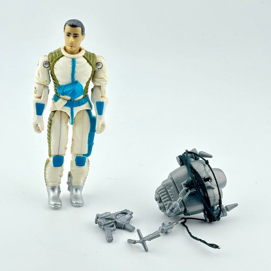 GI Joe action figure with accessories on white background. 