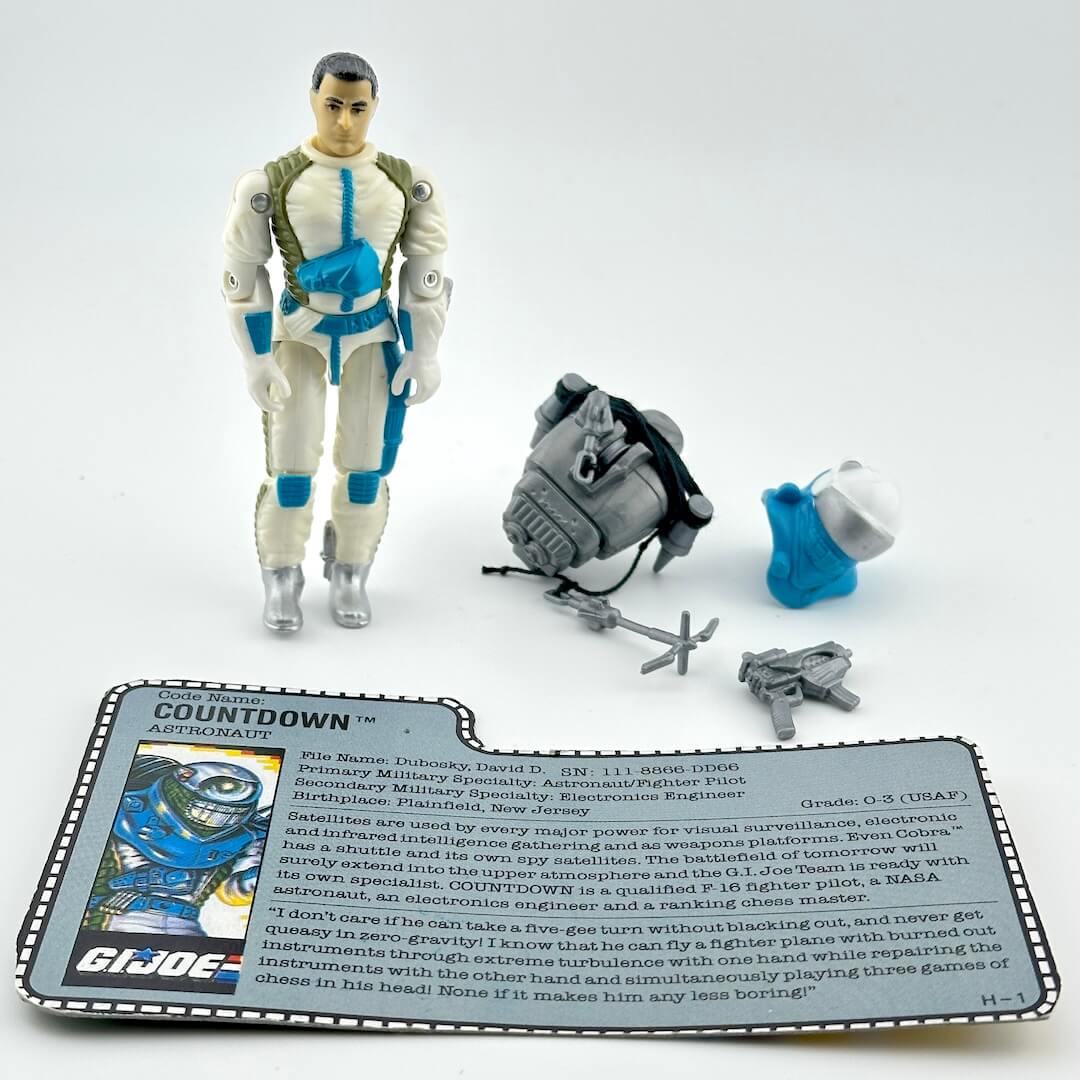 GI Joe action figure with accessories and character card on a white background