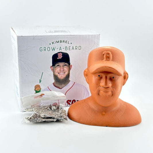 Terracotta bust of a man wearing a baseball cap with a package labeled 'Kimbrel Grow-A-Beard' on a white background.