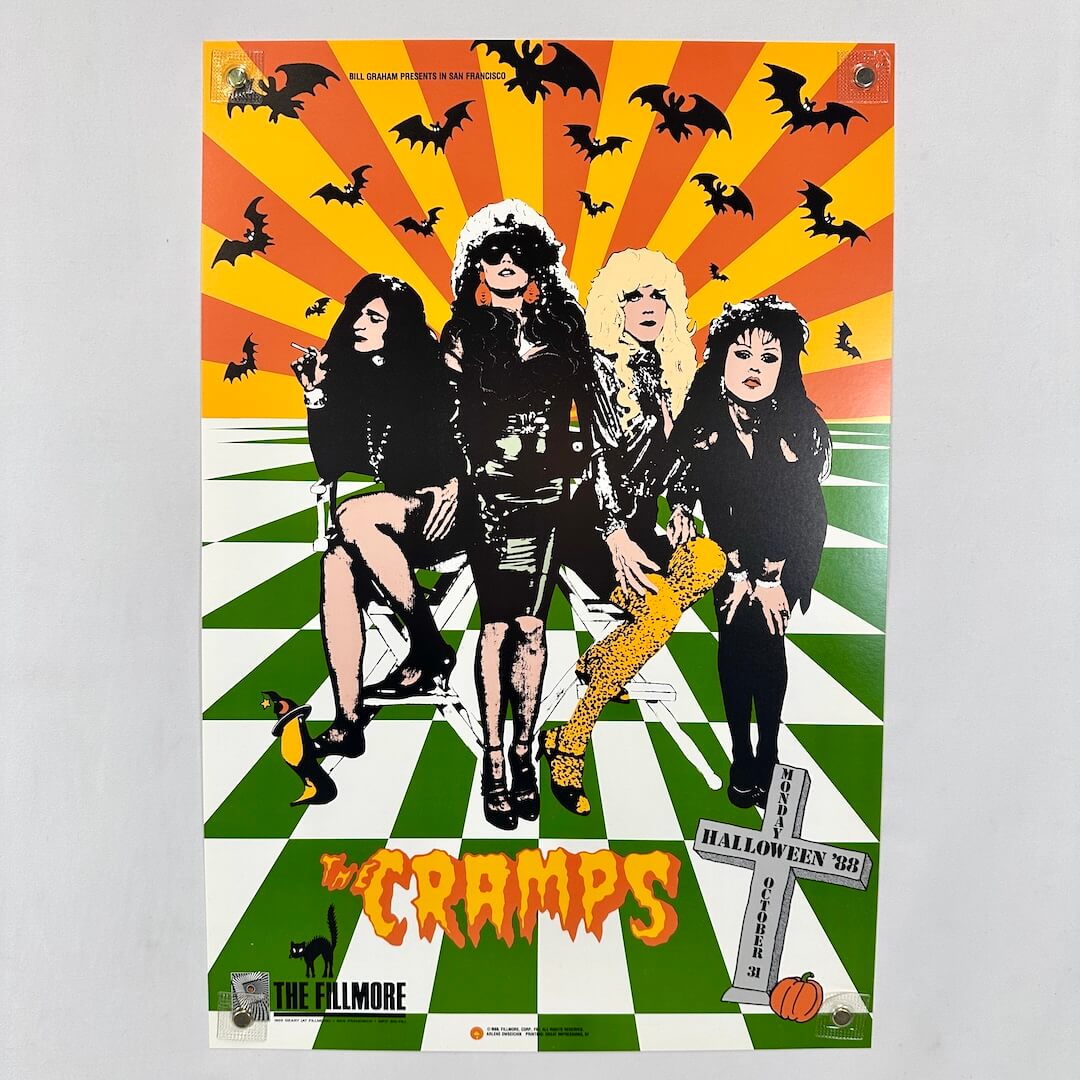 Poster of The Cramps with a band members on checkered floor, surrounded by bats and Halloween elements.