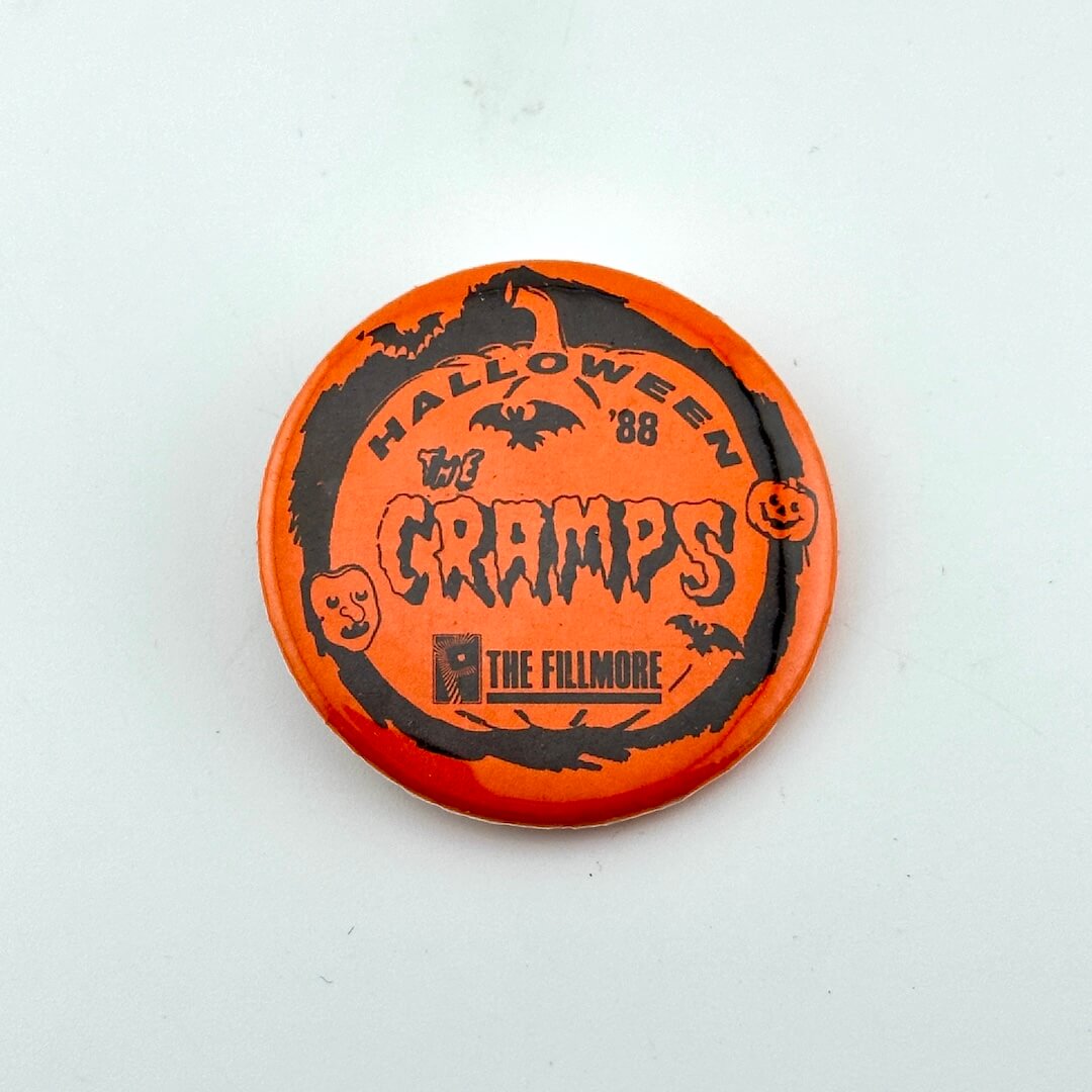 Orange button with black text and graphics on a white background