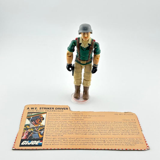 Action figure of a soldier with a helmet and green uniform on a white background, accompanied by a character card.