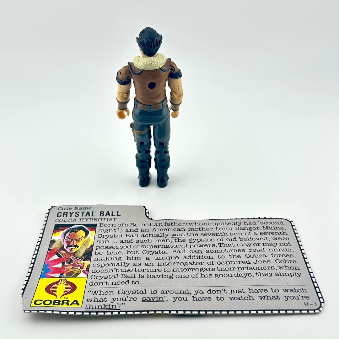 G.I. Joe action figure with character card against white background.