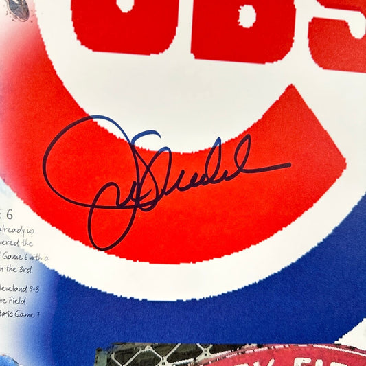 Close-up of a sports team logo with a signature, featuring red, white, and blue colors.