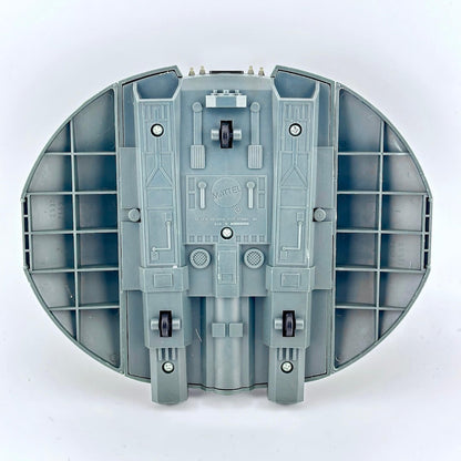 Gray toy model of a spaceship with visible branding on a white background