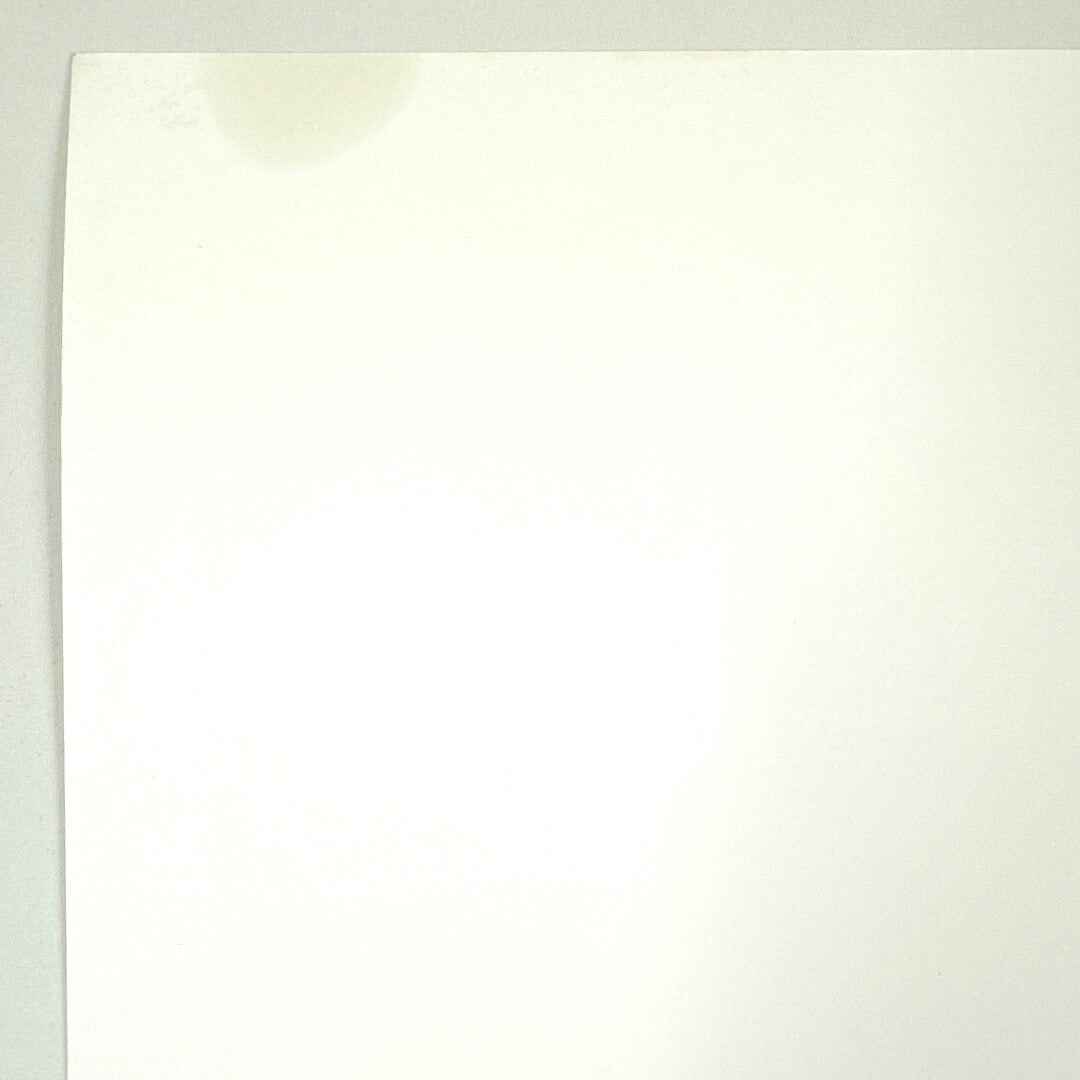 Close-up of gas stain in top right corner, less that twoo inches wide. 