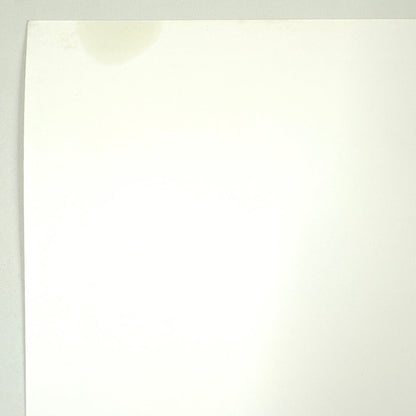 Close-up of gas stain in top right corner, less that twoo inches wide. 