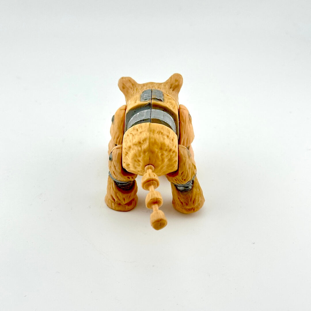 Toy figure of a dog-like creature on a white background