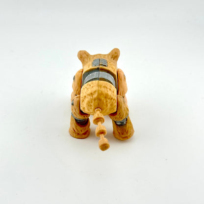 Toy figure of a dog-like creature on a white background