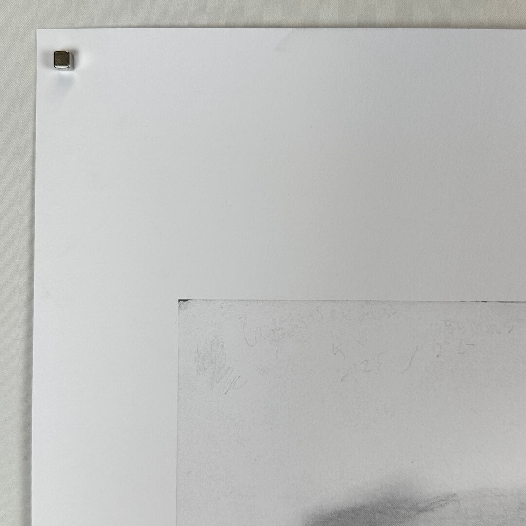 Top left corner of print with no visible damage. 