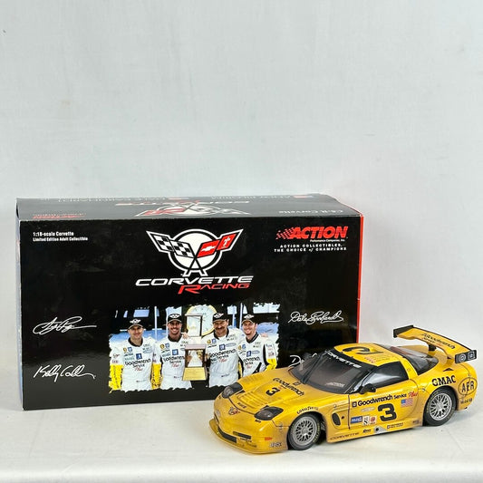 Yellow Corvette racing car model with a black box featuring Corvette Racing logo on a white background