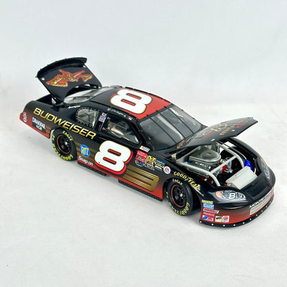 Model race car with open hood on a white background