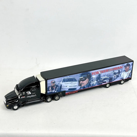 Model truck with a trailer displaying images and text on a white background