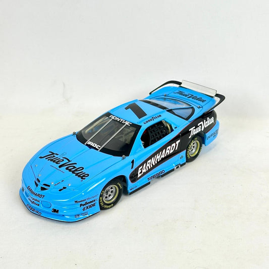 Model race car with blue and black livery on a white background