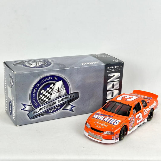 Orange race car model with 'Wheaties' and 'Goodwrench' branding next to its packaging on a white background