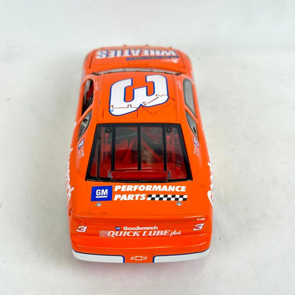 Model car with various sponsor logos on a white background