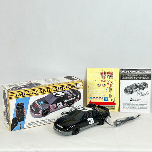 Model car with Dale Earnhardt logo, packaging, and instructions on a white background