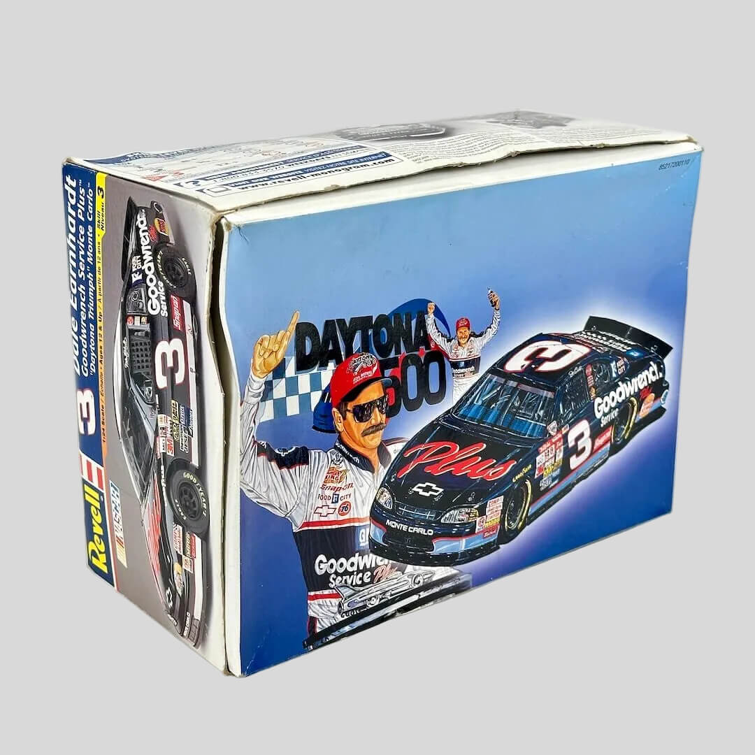 Model car packaging with racing theme and driver illustration on a white background