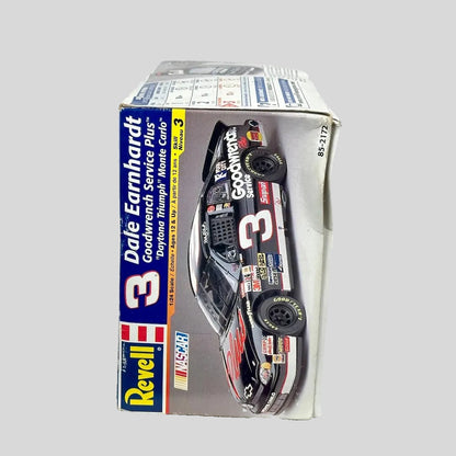 Model car in packaging with Dale Earnhardt branding on a gray background