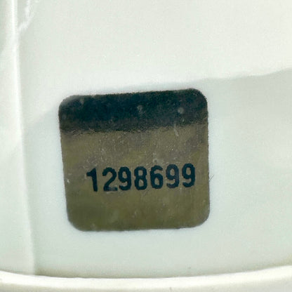 Close-up of authentication sticker with visible number. 